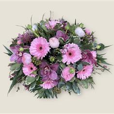 Pretty pinks funeral posy 